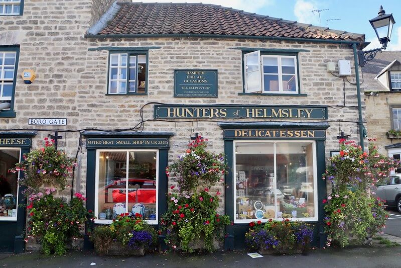 a delicatessen called Hunters of Helmsley, with lots of plants and flowers decorating its frontage